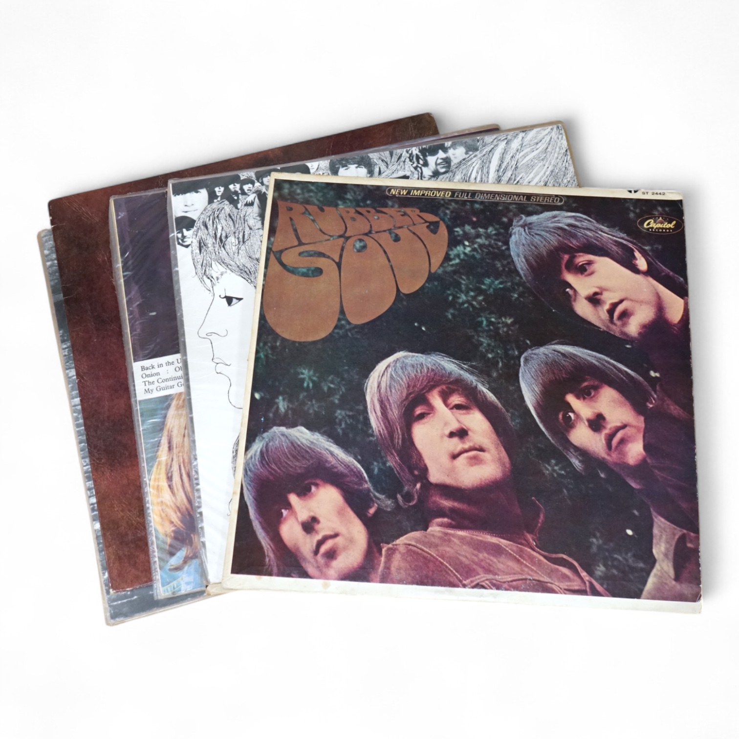Seven The Beatles LP record albums including; Rubber Soul, two copies of Revolver, The Beatles Vol.1 - Chilean pressing, Love Songs, John Lennon; Rock ‘n’ Roll, Paul McCartney RAM - Chilean pressing.